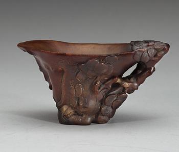 A rhinoceros libation cup, Qing dynasty, ca 1700.