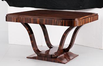 An art deco lacquered palisander dinner table, probably France, 1920's-30's.