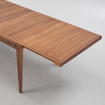 A walnut veneered extendable 'S-table' from Gubi.