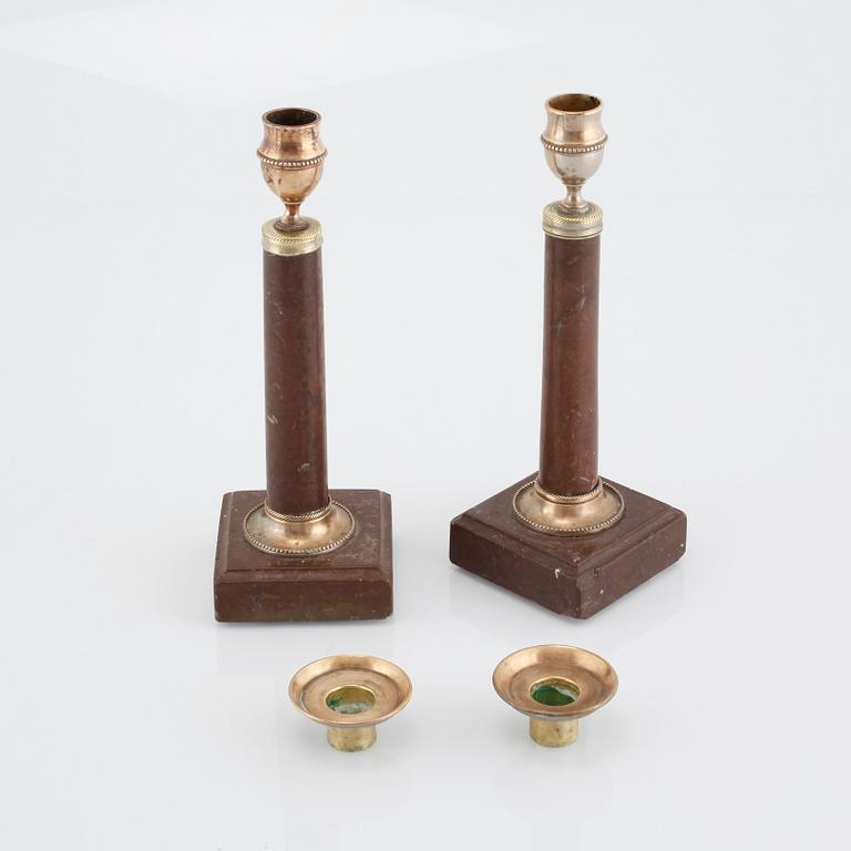 A pair of late gustavian candlesticks, made around year 1800.