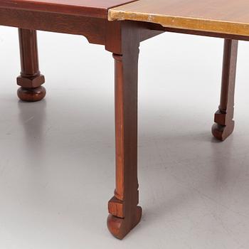 A mahogany and oak dining table, second half of the 20th century.