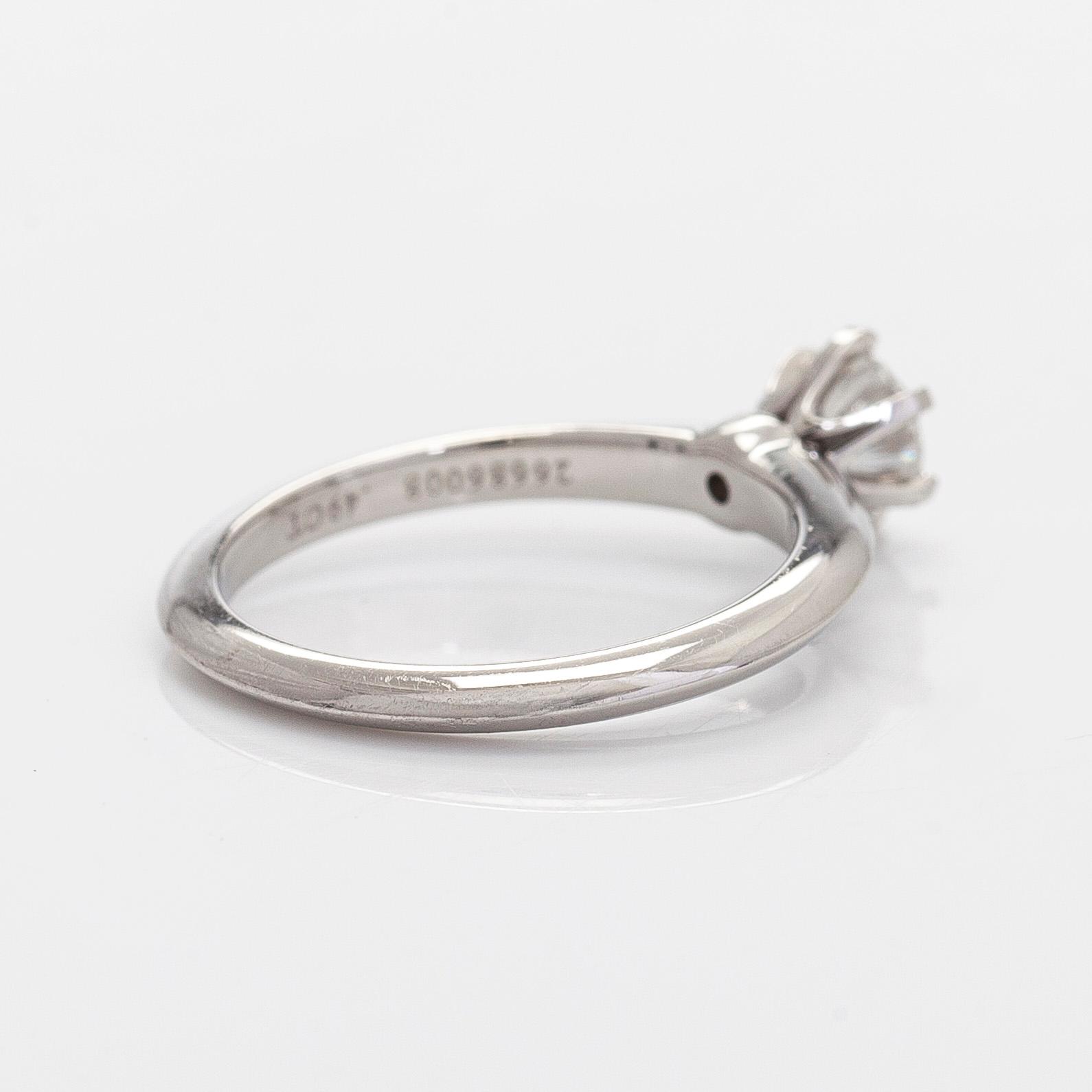 Tiffany & Co, a platinum solitaire ring with a brilliant-cut diamond.