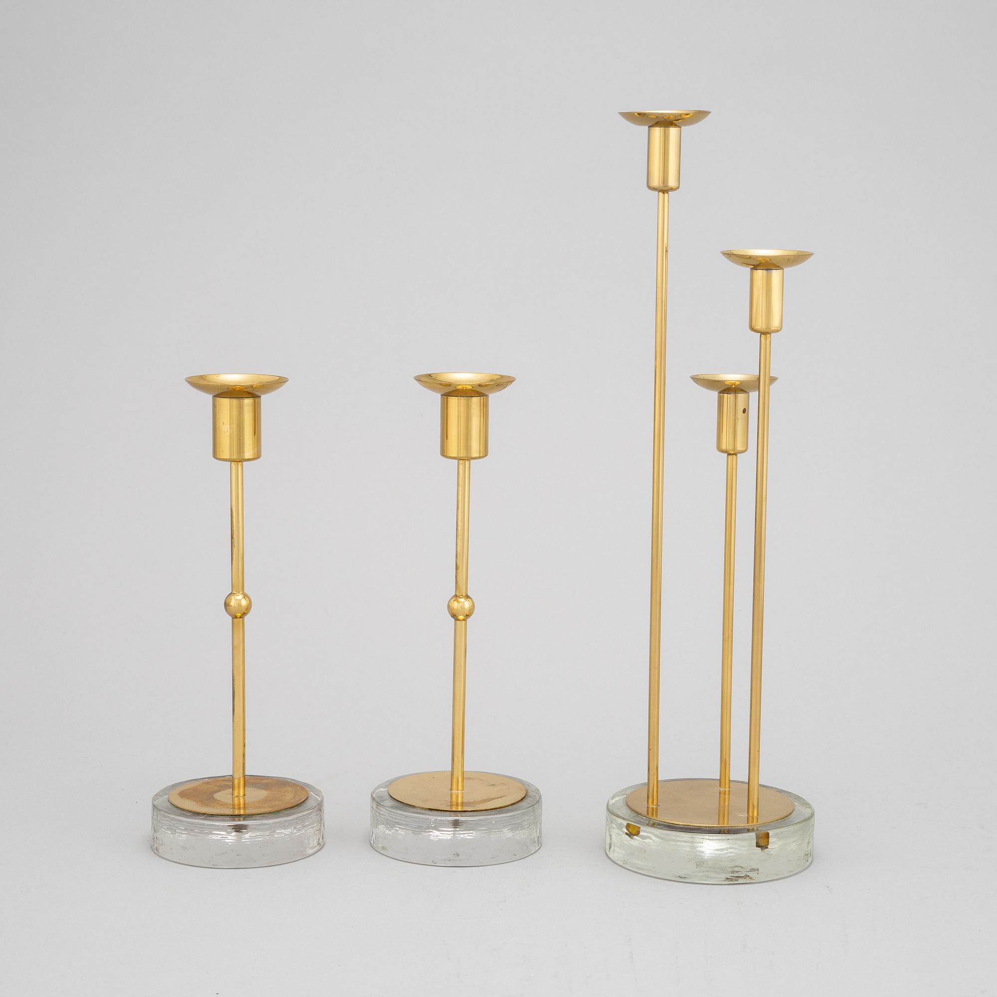 Gunnar Ander, a set of three brass and glass candlesticks from Ystad Metall.
