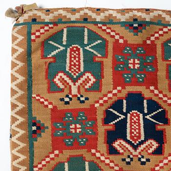 A CARRIAGE CUSHION, "Palmetter och blommor", double interlocked tapestry, ca 105 x 54,5 cm, Scania, Sweden,
