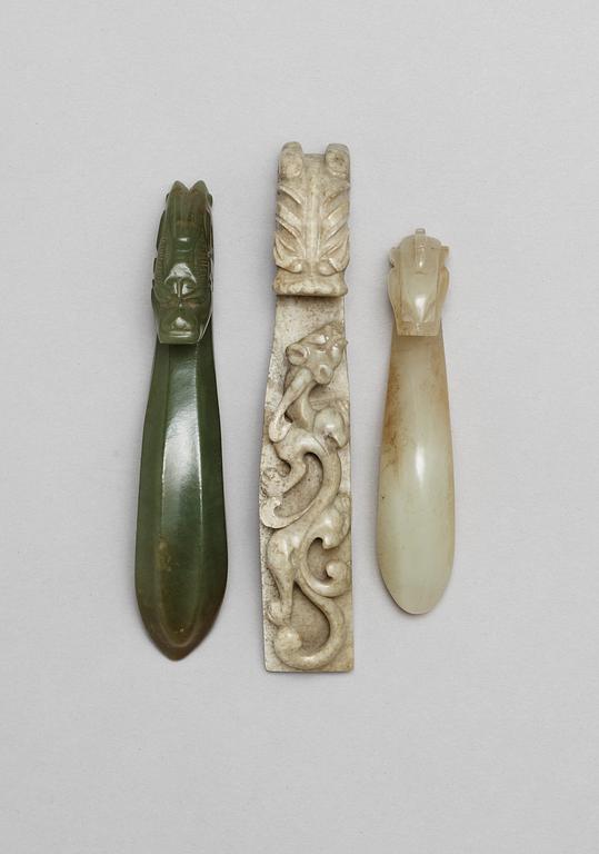 A set with three archaistic nephrite belt buckles, Qing dynasty.