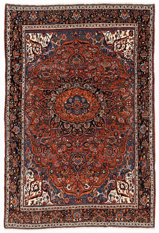 A semi-antique Abadeh carpet, approximately 296 x 191-196 cm.