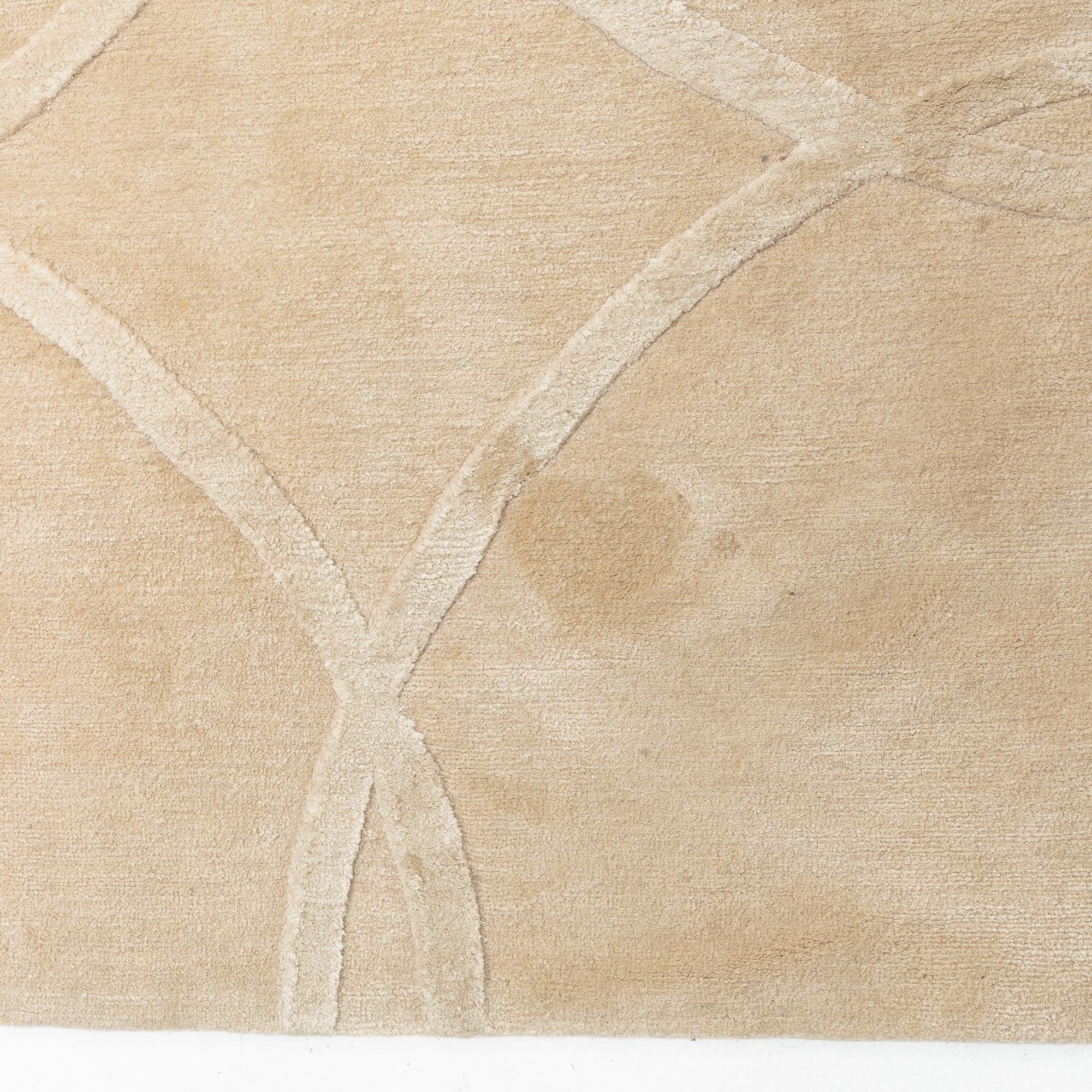 A carpet 360 x 360 cm.