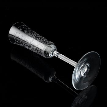 A set of 18 champagne flutes, engraved with animals and leafwork, 20th century Europe .
