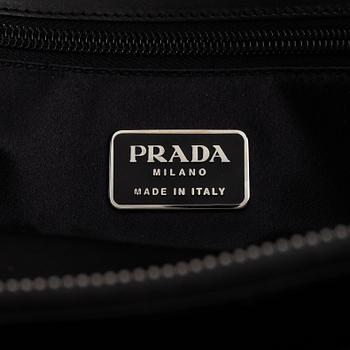 Prada, a black leather bag.