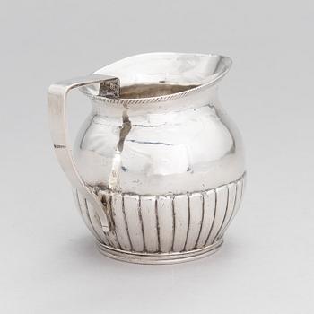A silver, cream jug, Cyrillic maker's mark Sinkoni, Finland 1824.