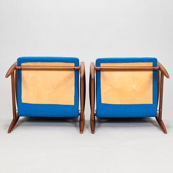 A pair of 1950's armchairs.