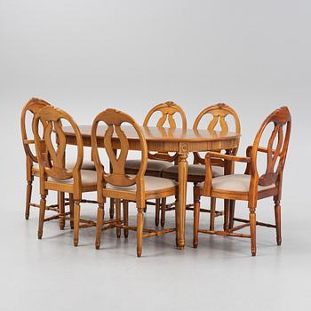 A Gustavian style dining table with two armchairs and four chairs, late 20th century.