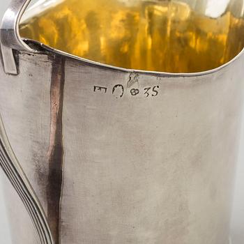 a 1824's silver creamer.