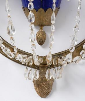 A pair of Russian Louis XVI-style  four-branch gilt bronze appliques, 19th century.