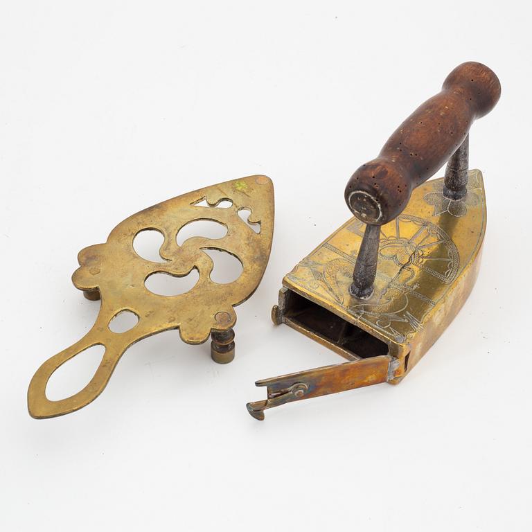 A set of four Swedish brass irons, 18th/19th Century.