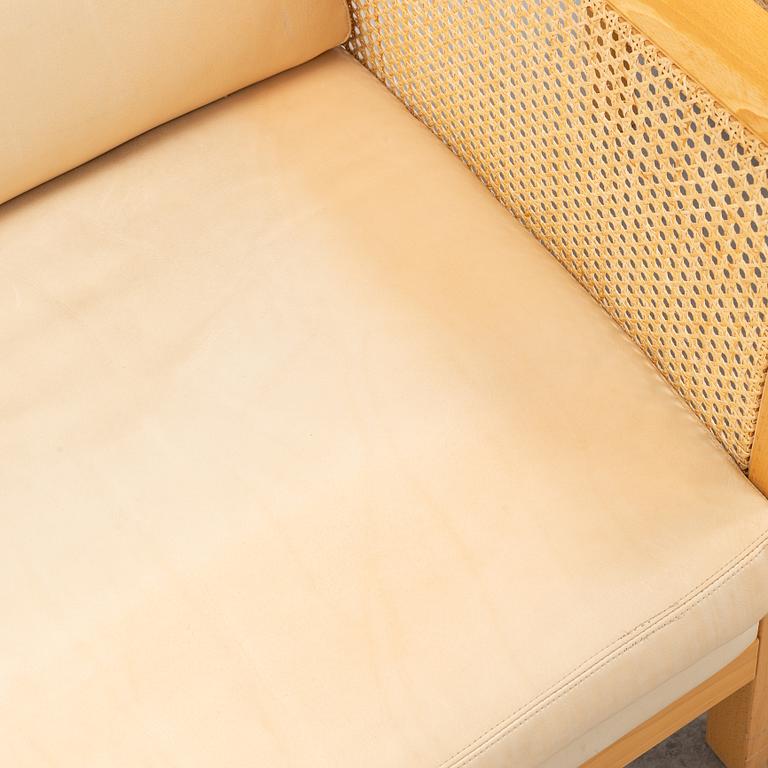 A pair of 'Rotan' easy chairs by Arne Norell, end of the 20th Century.