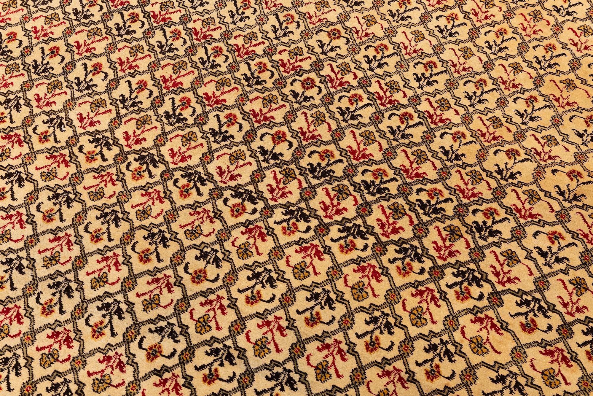 An antique Agra carpet Of Mughal 'Shrub' design, Northern India, c. 335 x 287 cm.
