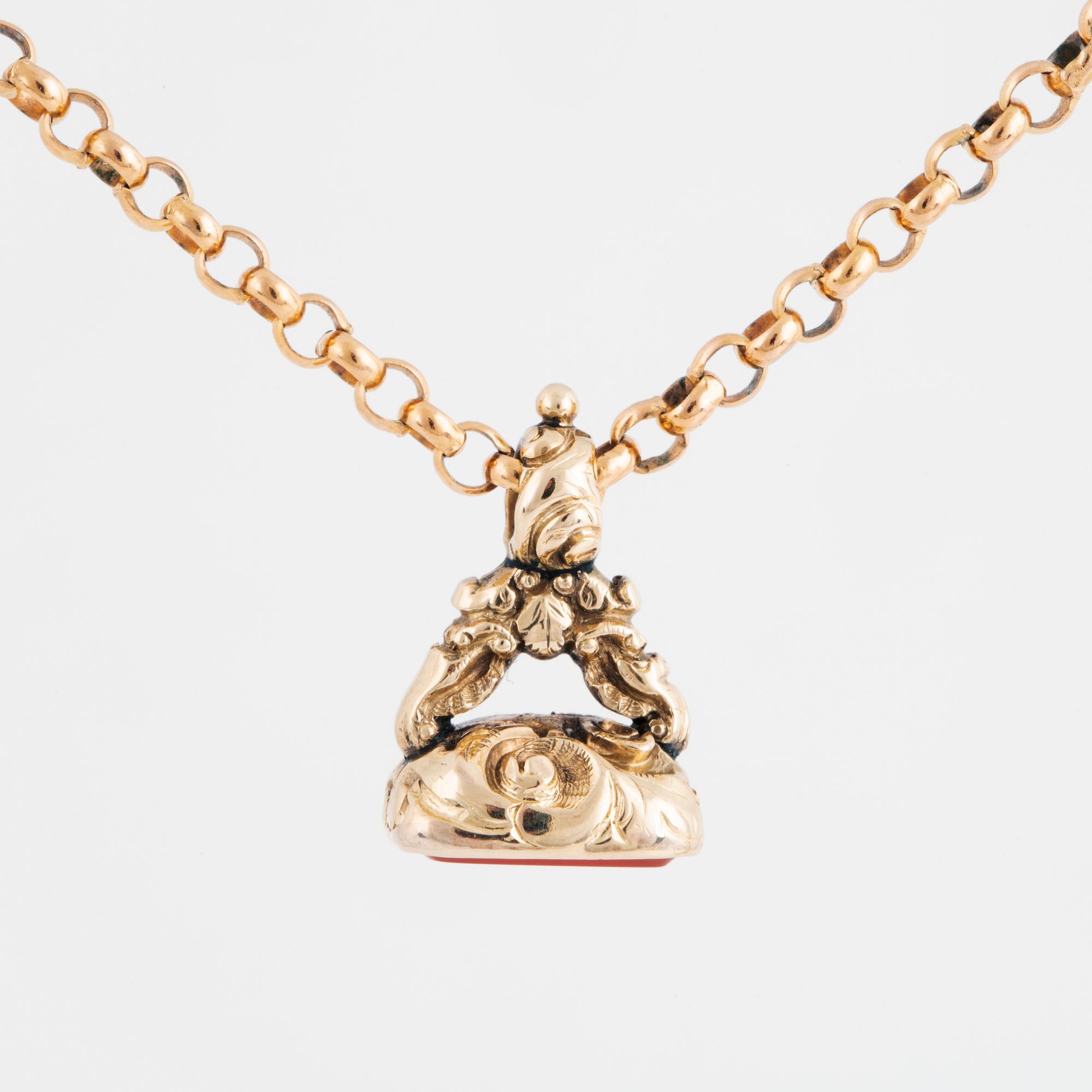 A carnelian seal in a chain.