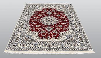 A rug, Nain part silk, ca 208 x 149 cm.