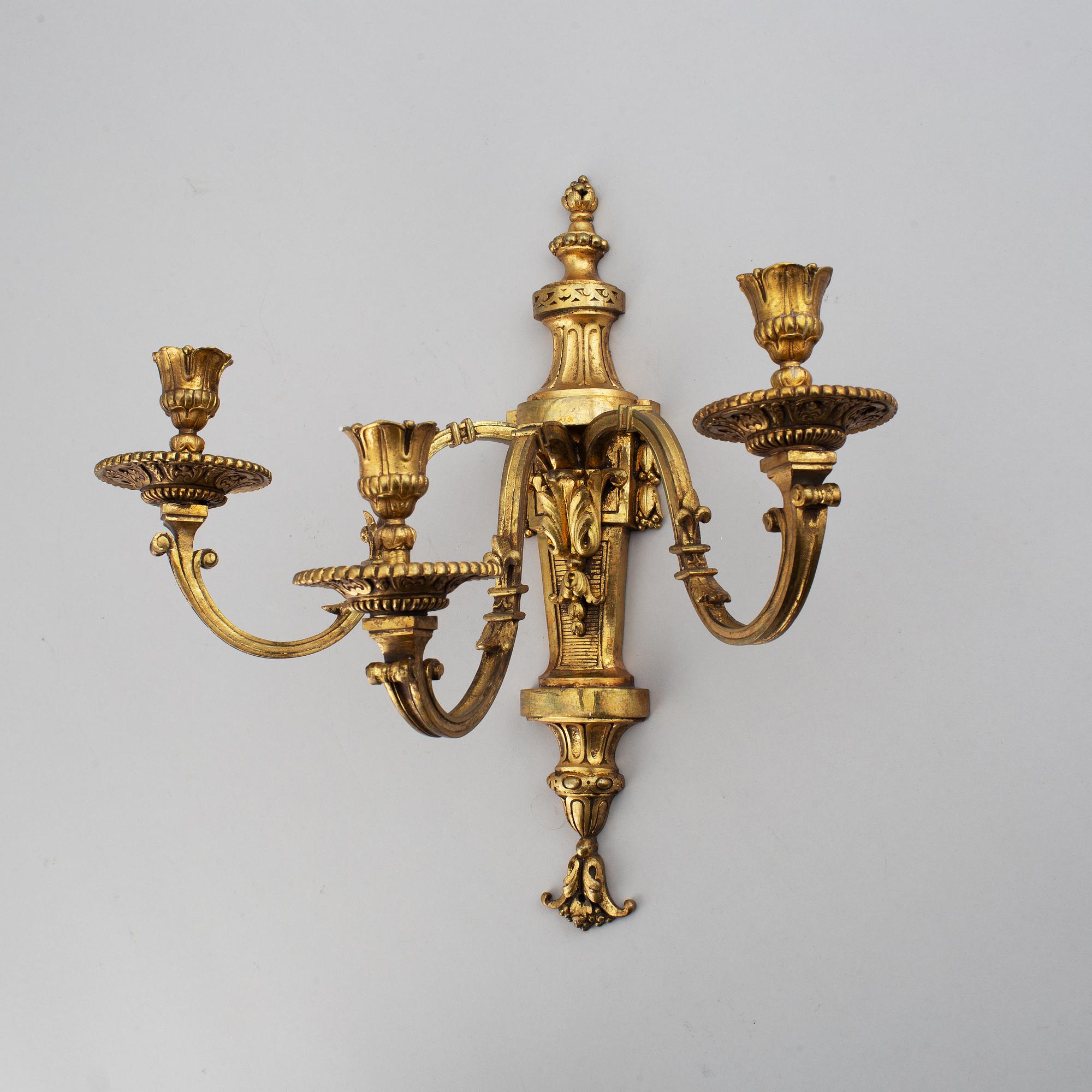 A pair of gilt bronze Louis XVI style wall lights. Late 19th century. 80.