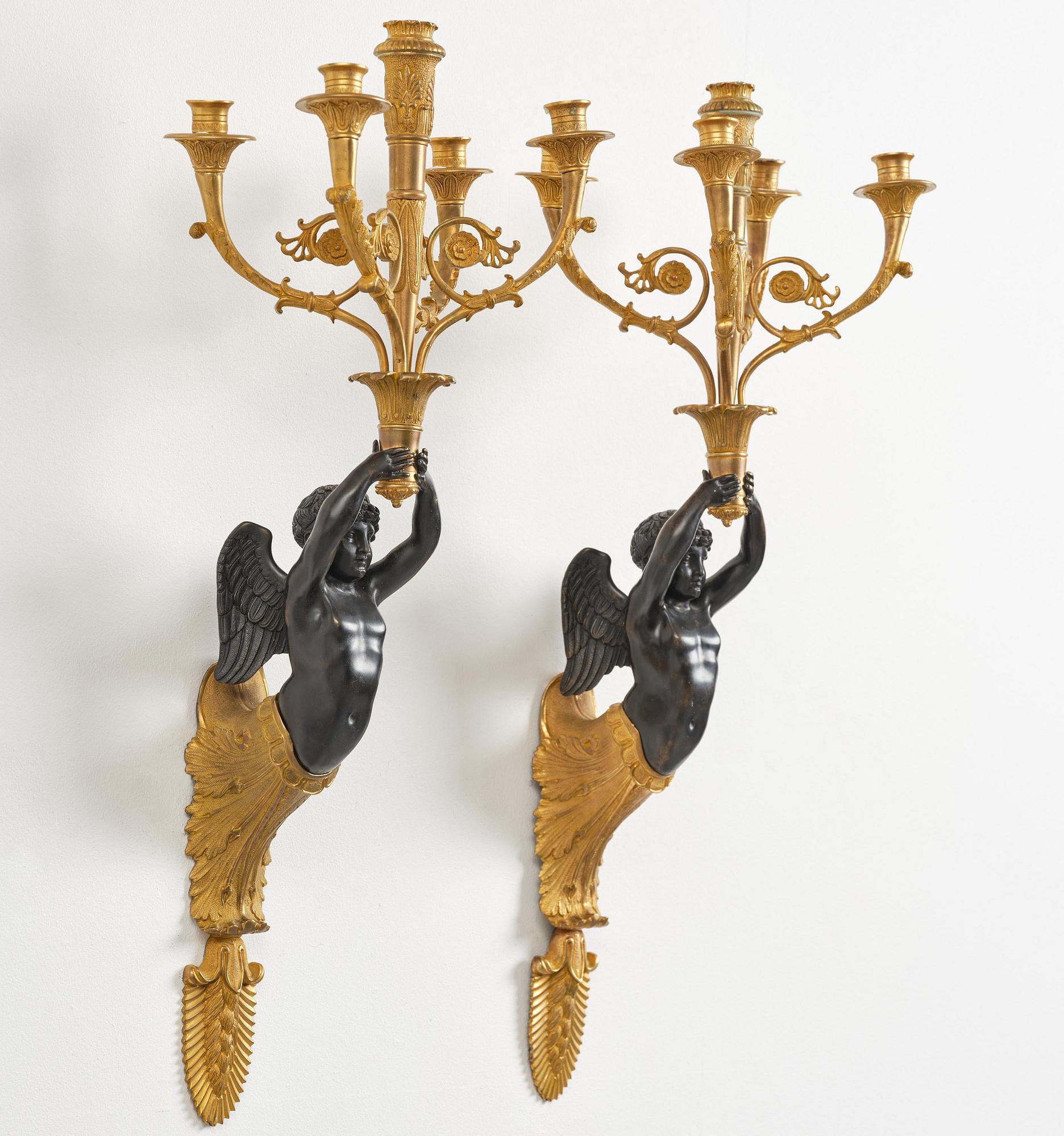 A pair of Napoleon III five-branch gilt and patinated bronze appliques.