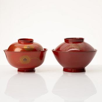 A group of nine Japanese lacquer bowls with covers, Meiji and 20th century.