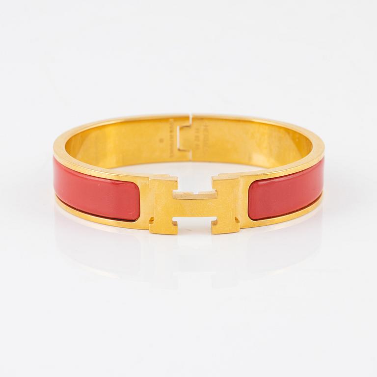Hermès, a 'Clic H PM' bracelet.