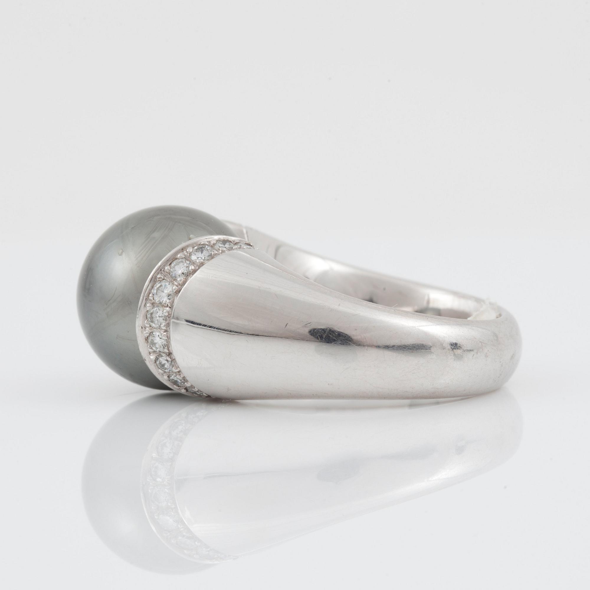 A cultured Tahiti pearl and diamond ring made by Gübelin.