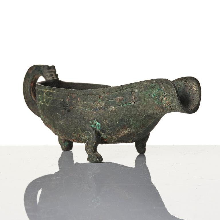 A Chinese brushpot, Qing dynasty, circa 1900. An archaistic bronze ewer and a silvered South East Asian bowl with stand.