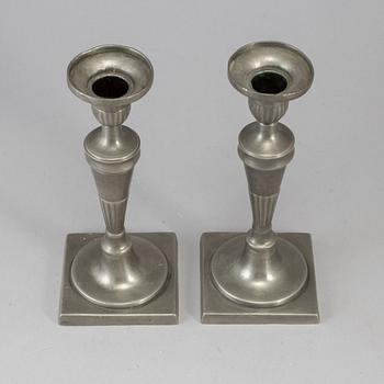 A pair of 18th century pewter candlesticks.