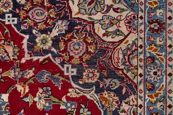 An oriental carpet, a. 419 x 295 cm.