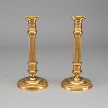 A pair of Empire bronze candlesticks, first half of the 19th century.