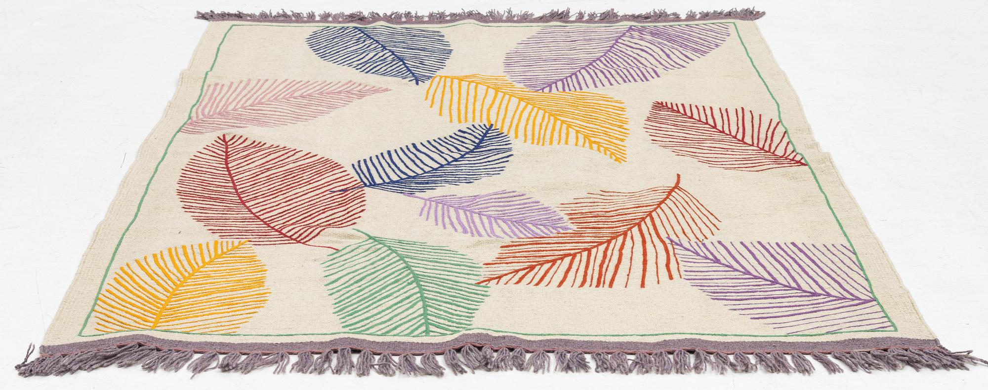 A hand-embroidered Kilim rug, c. 199 x 145 cm.