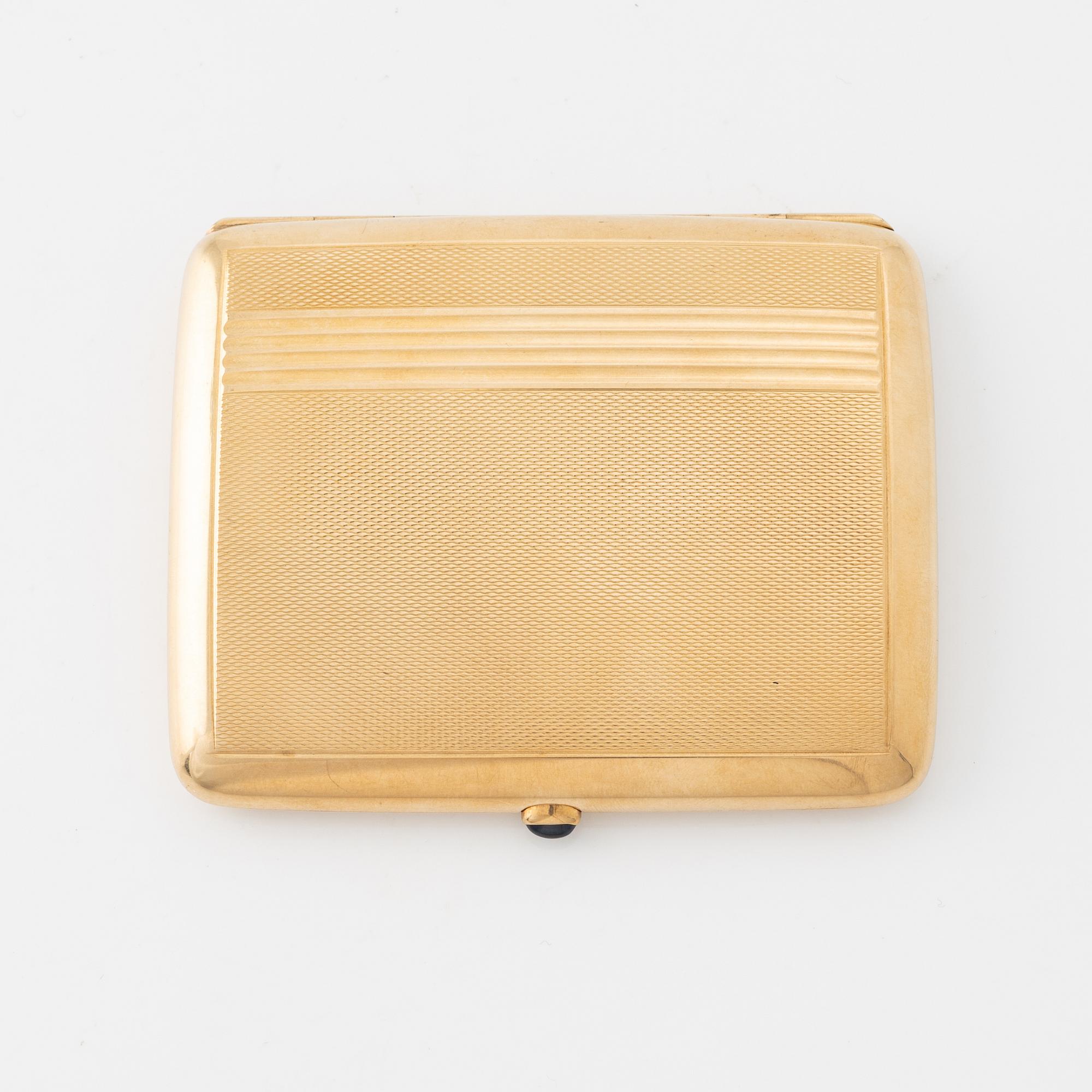 A 14 carat gold cigarette case.