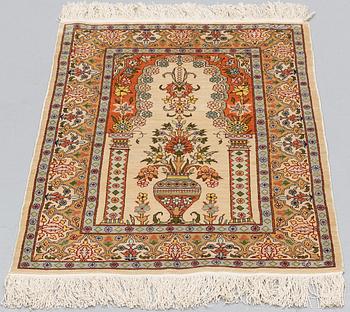 A RUG, Silk, Hereke, PROBABLY 82 x 54 cm.