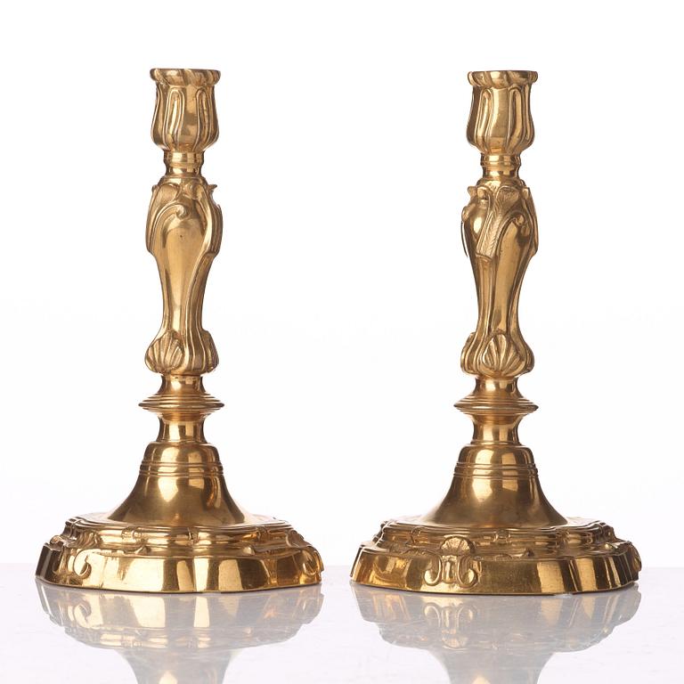 A pair of French Louis XV 18th century gilt bronze candlesticks.