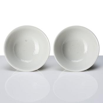 A pair of white glazed anhua stemcups, Qing dynasty, 19th Century.