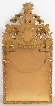 A 20th century Baroque style mirror.