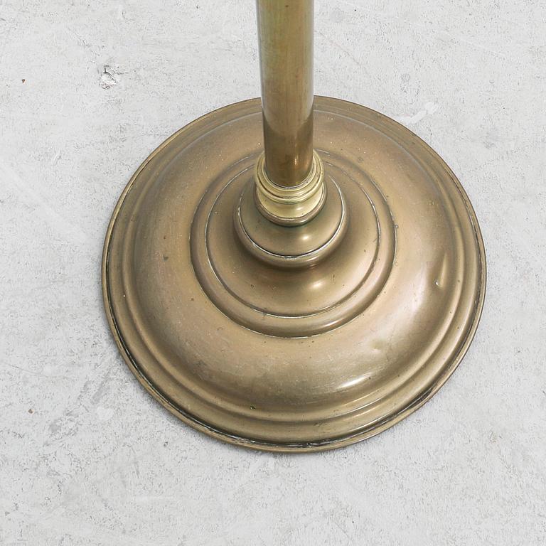 An early 1900s brass floor lamp.