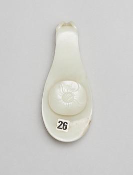 A pale green nephrite garment hook, Qing dynasty.