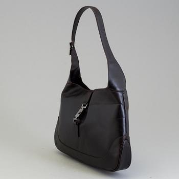 A LEATHER JACKIE BAG BY GUCCI.