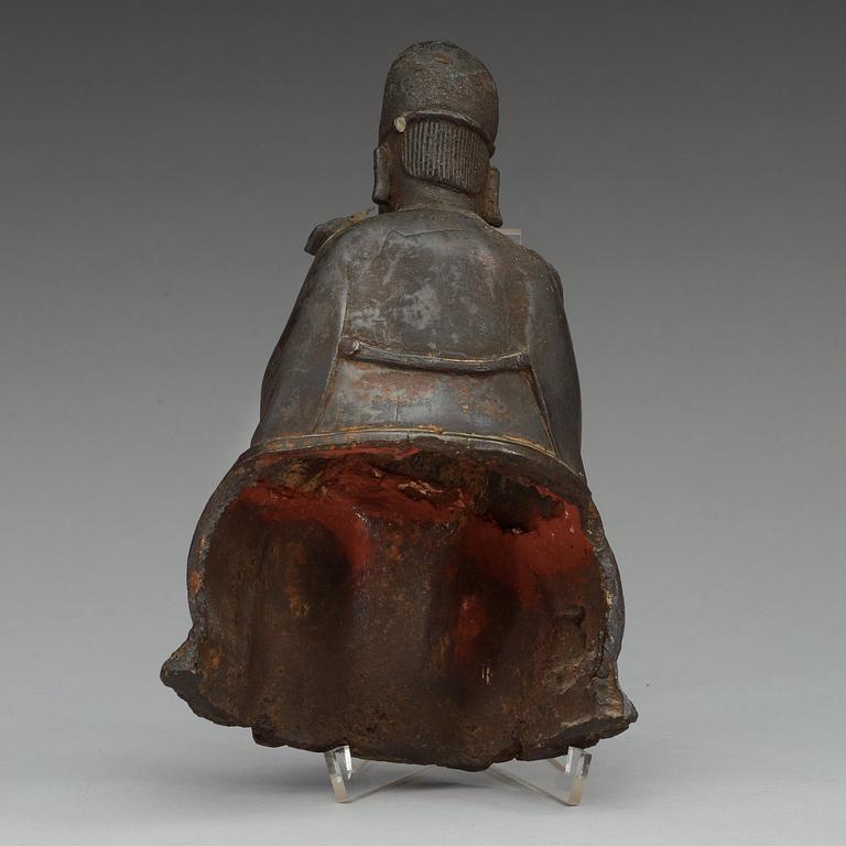 A bronze sculpture of a sitting deity, Ming dynasty (1368-1644).