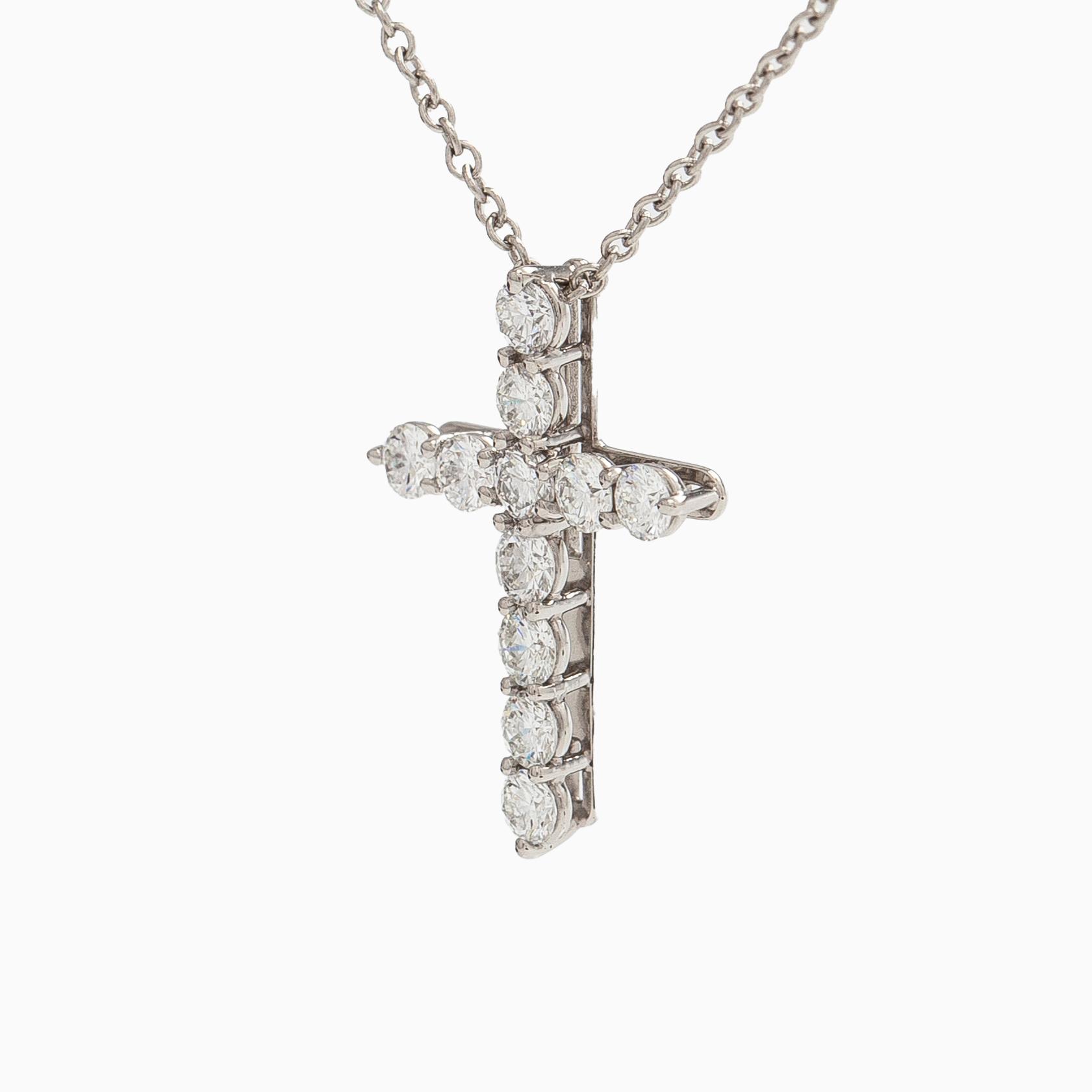 Tiffany & Co, a platinum cross pendant necklace with brilliant-cut diamonds.