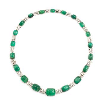 An art deco platinum necklace/bracelet combination with cabochon-cut emeralds.