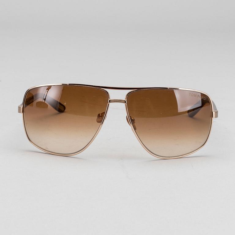 Two pair of Tom Ford Sunglasses.