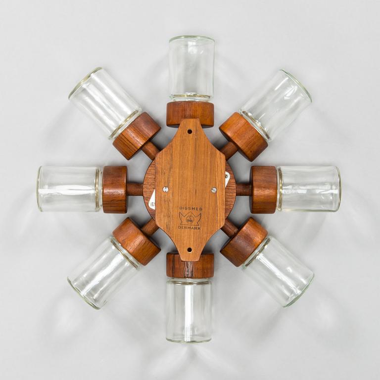 A Danish 1960s wall mounted spice rack in teak and glass from Digsmed.