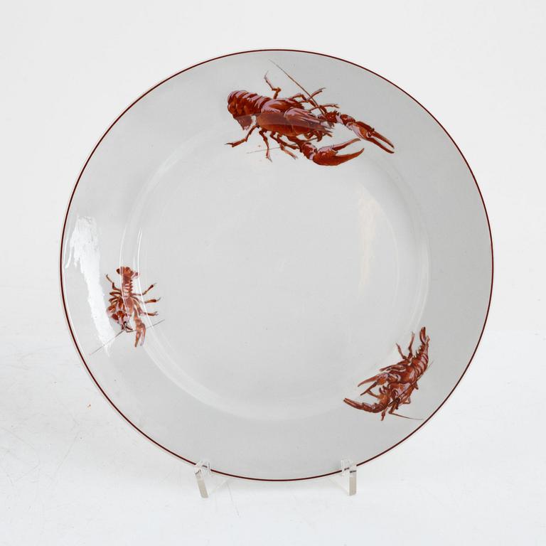 A creamware crayfish bowl, Rörstrand. Twelve side plates, Gustafsberg, early 20th Century.