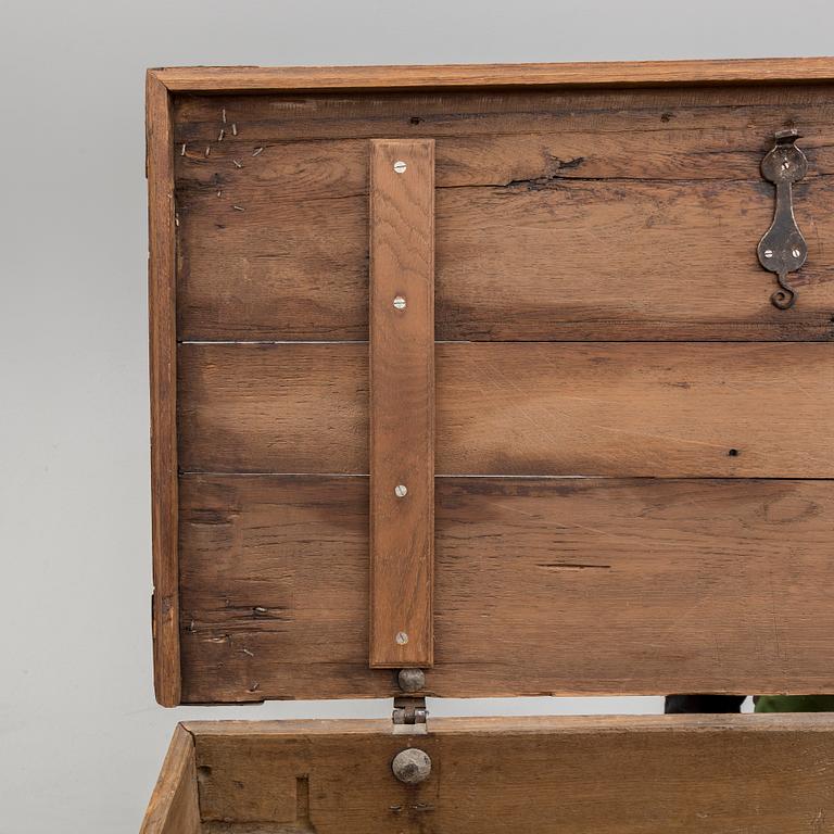 A 18th century baroque oak chest with iron mountings.