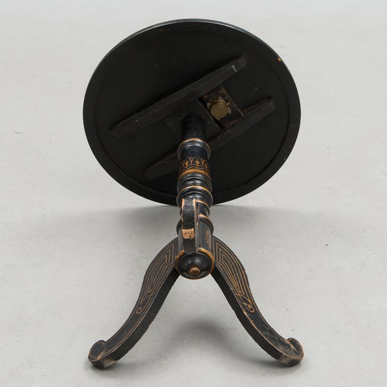 A 20th century Chinese tilt top table.