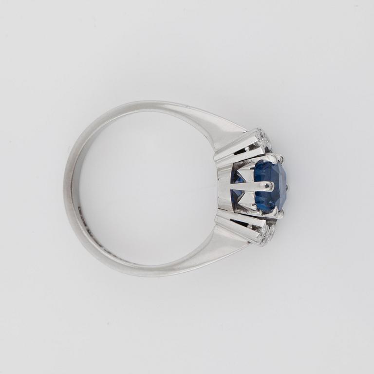 A sapphire and brilliant-cut diamond ring.